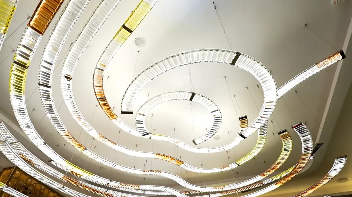 Sculptural spiral crystal lighting displayed in the showroom