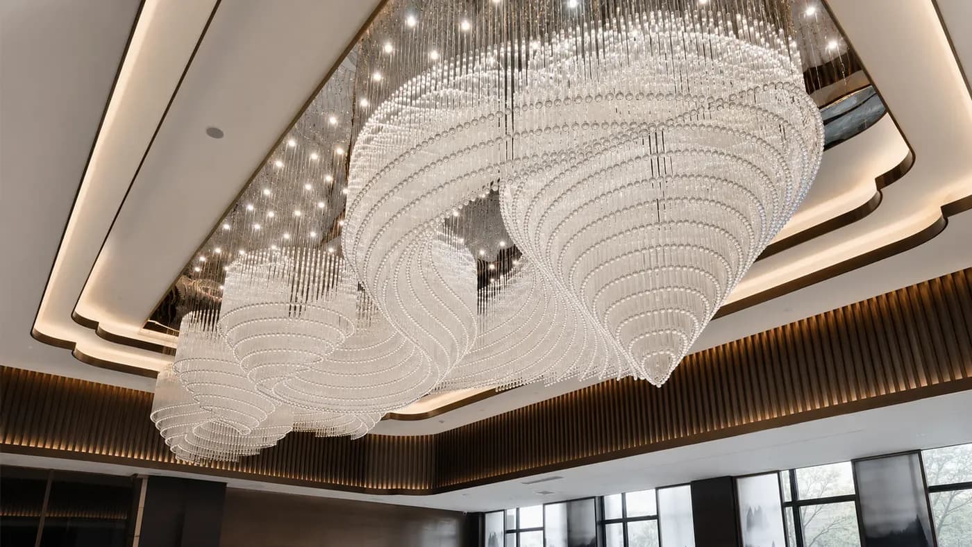 Large-scale illuminated crystal lighting installation in an architectural interior
