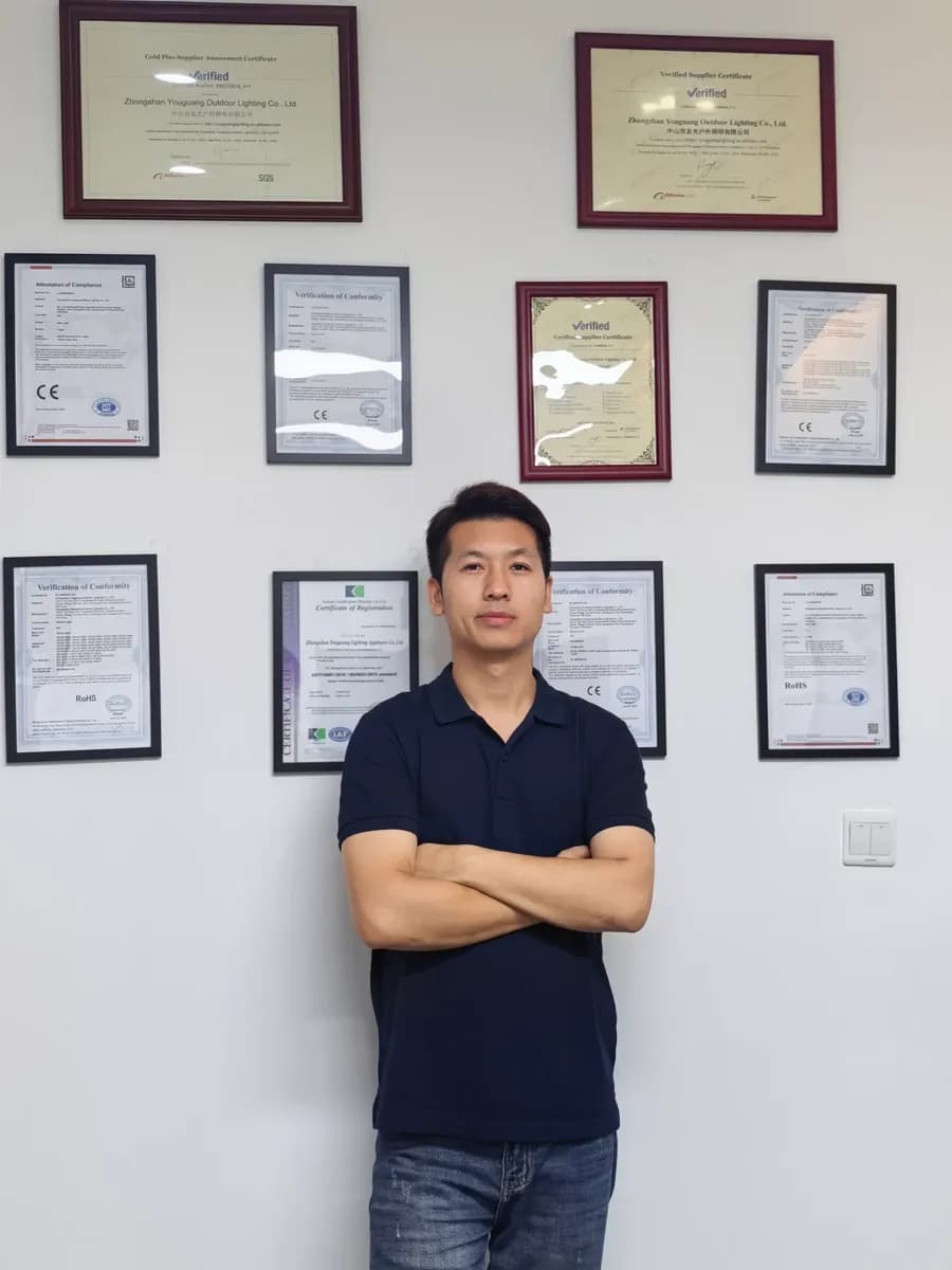 Owen, General Manager of Maison Foncen, in front of company certificates