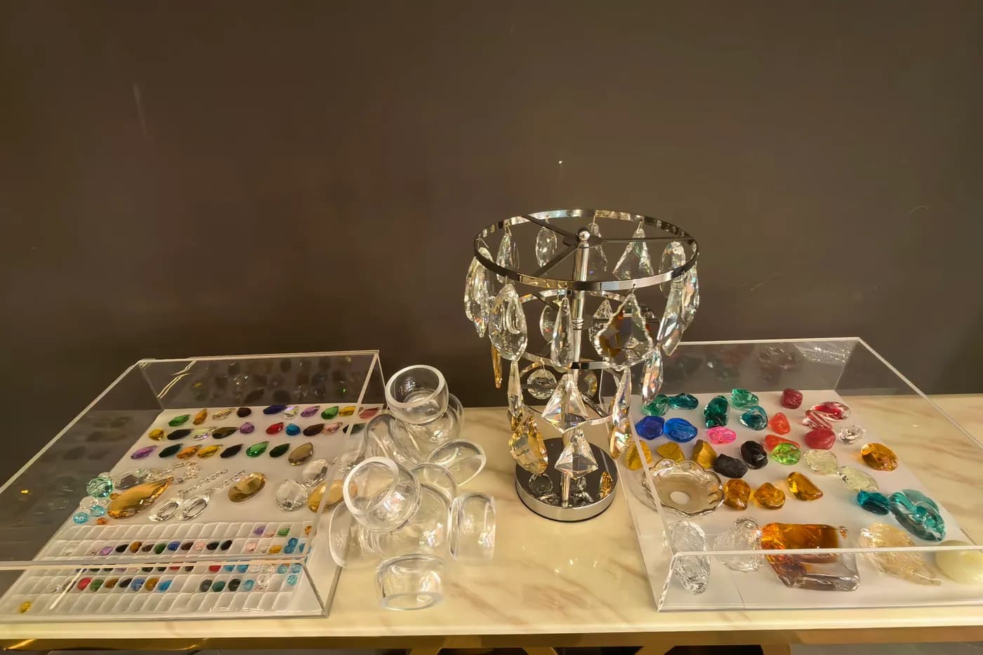 Crystal and decorative glass samples displayed for custom lighting review