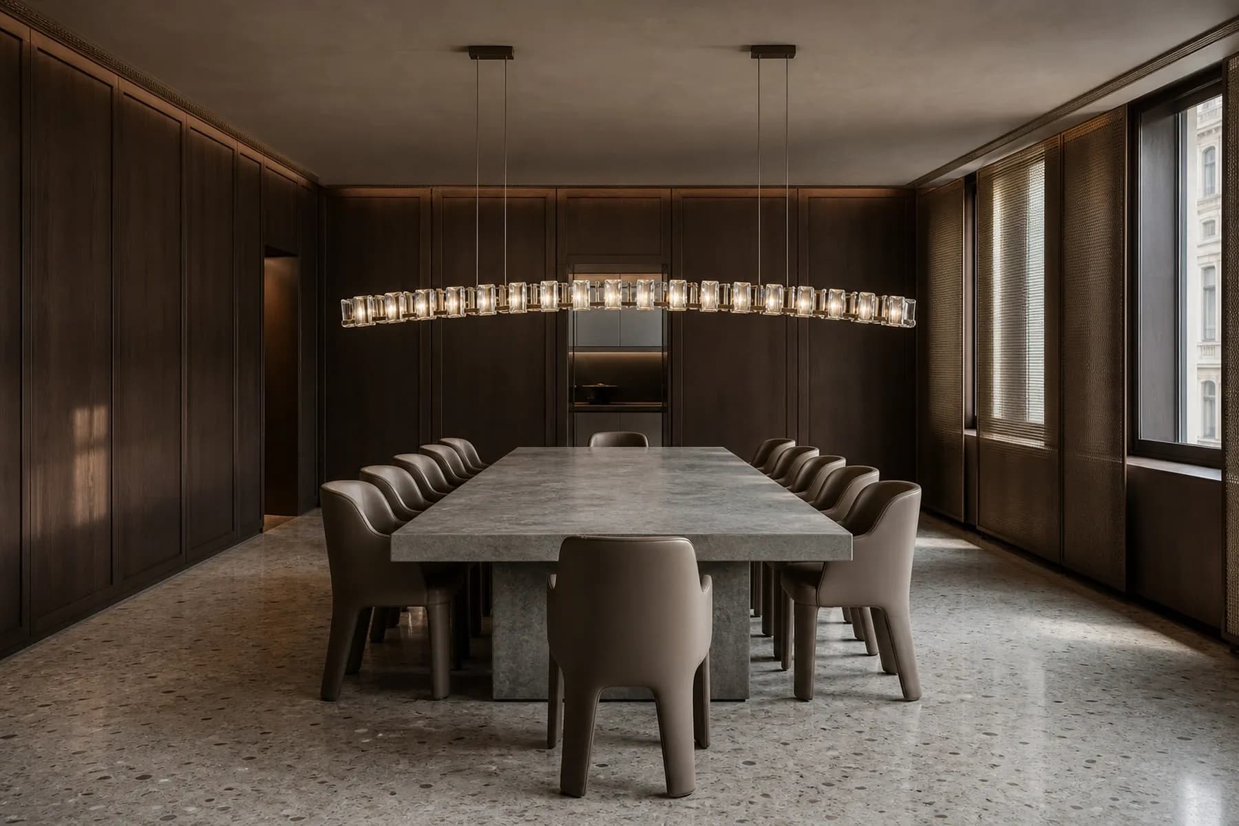 Walnut Milan dining salon with a low arched chandelier of 24 crystal modules